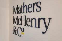 3D-cut-acrylic-logo-installed-flush-to-the-wall-with-tape
