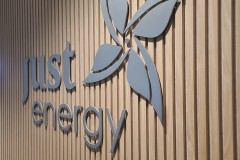 3D-cut-aluminium-logo-raised-from-the-wooden-wall-Just-Energy-Shortcut