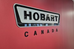 Custom 3D cut acrylic graphics and cut to shape brushed aluminum panel "Hobart Canada"