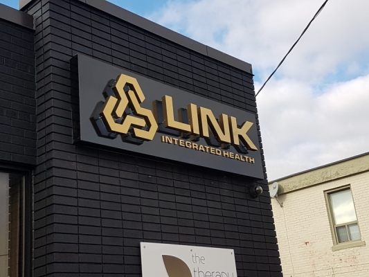 Titanium gold stainless steel fabricated letters illuminated from behind