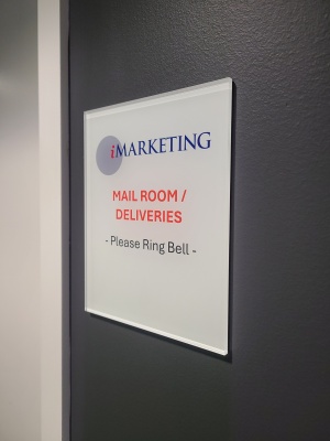 Clear acrylic door sign with reversed print