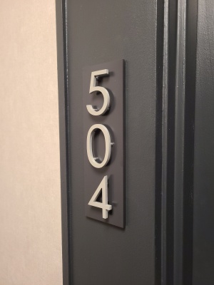 Custom raised aluminum apartment numbers