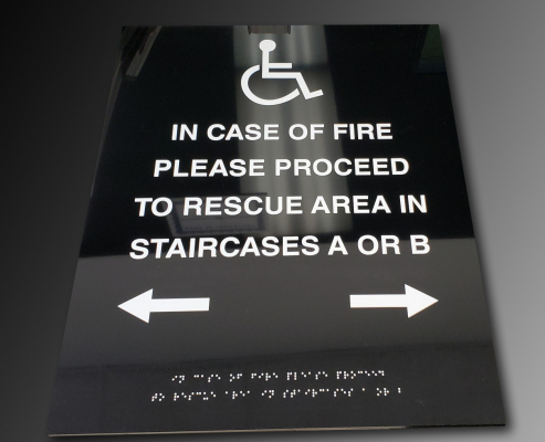 Raised-text-and-braille-handicap-sign