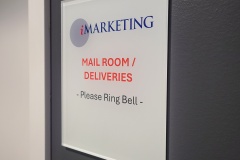 Clear acrylic door sign with reversed print