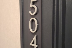 Custom raised aluminum apartment numbers