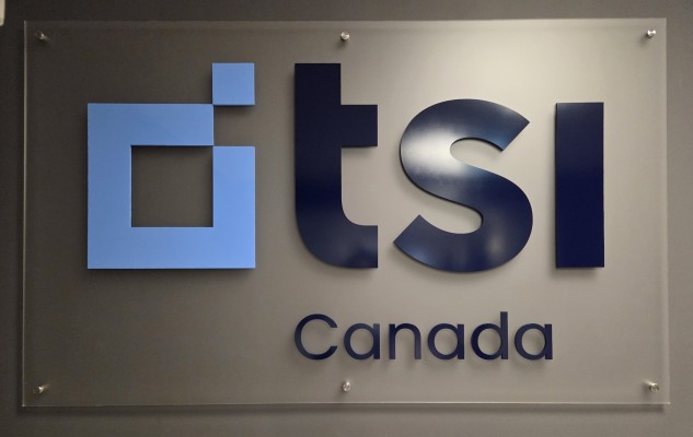 Frosted acrylic reception sign with 3D cut acrylic logo "tsi"