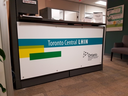 White acrylic reception sign installed with aluminium pins LIHN