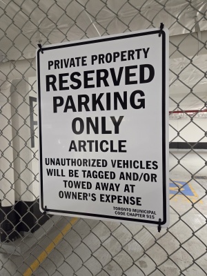 Custom aluminum parking sign with personalized name