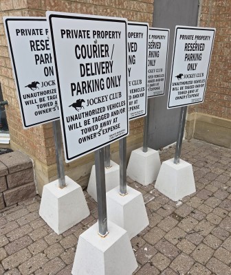 Custom aluminum parking signs-with concrete posts
