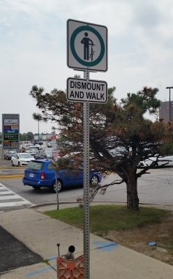 Reflective dismount and walk sign