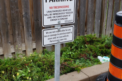 Custom parking sign with concrete base and post