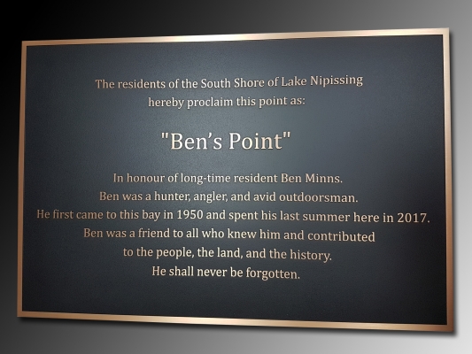 Bronze plaque with raised text and border Ben