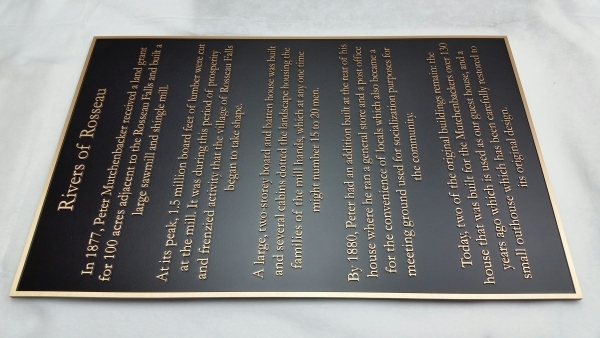 Bronze plaque with raised text