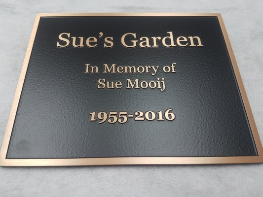 Raised text bronze plaque Sue's Garden