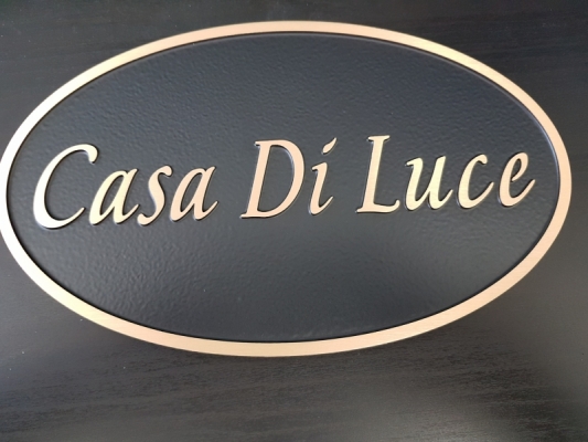 custom brushed bronze plaque with raised text and border Casa Di Luca