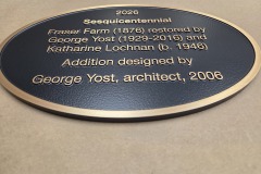 Oval shaped custom bronze plaque with raised graphics
